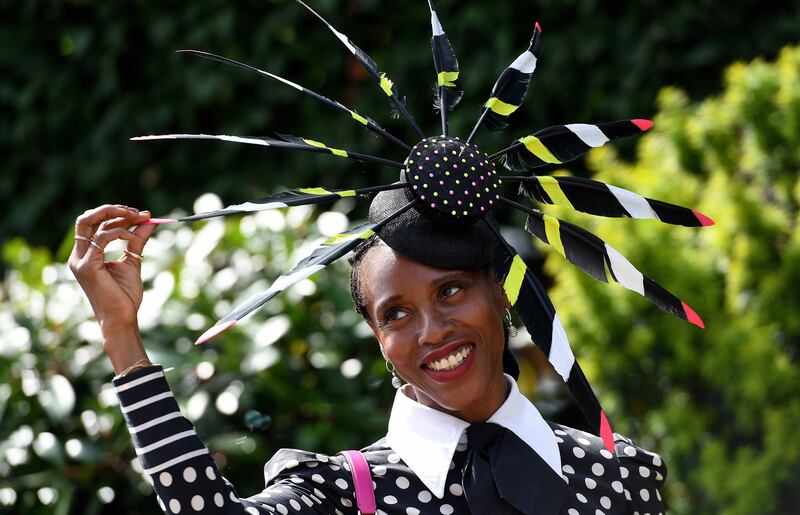 A dramatic black fascinator with pops of bright colour. EPA