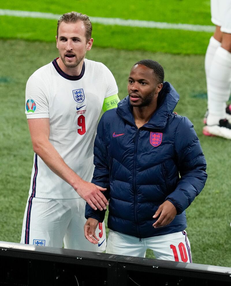 England's Harry Kane and teammate Raheem Sterling. AP