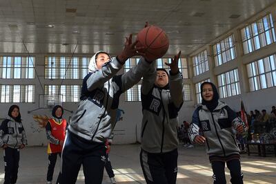 Hazara female basketball players take part in an event on International Women's Day in Bamiyan Province on March 8, 2021. (Photo by WAKIL KOHSAR / AFP)