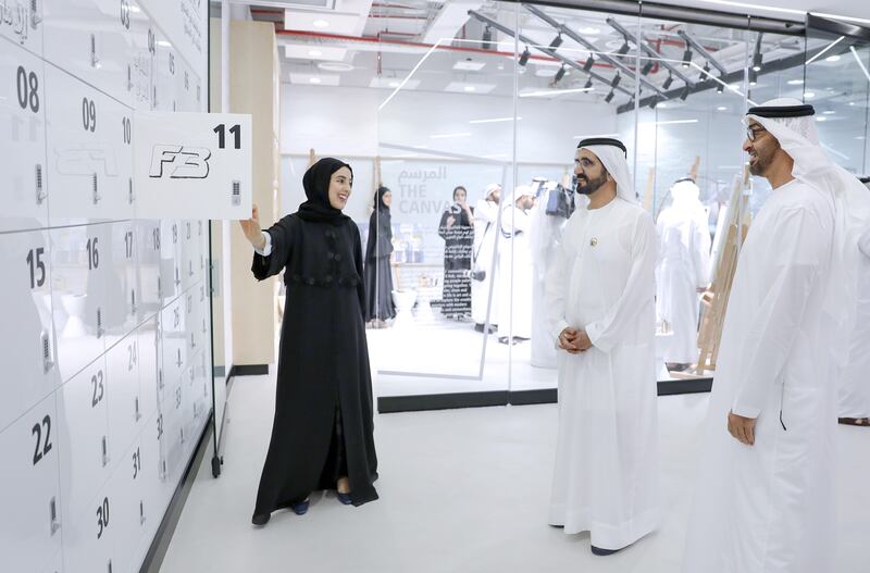 Shamma Al Mazrui shows Sheikh Mohammed bin Rashid and Sheikh Mohammed bin Zayed some of the features of the Youth Hub, including a locker marked F3 for Sheikh Hamdan. Wam