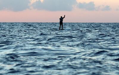 Cypriot standup paddle boarder Christis Michaelides paddles from Cyprus to Lebanon to raise funds and awareness for Beirut, in Cape Greco Peninsula, Cyprus October 16, 2020. REUTERS/Yiannis Kourtoglou     TPX IMAGES OF THE DAY