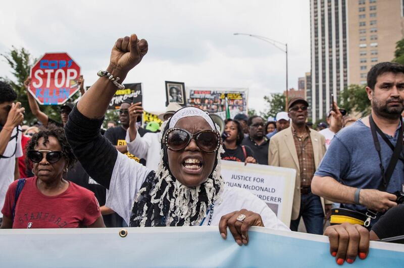 Anti-violence protesters march  in Chicago. Ashlee Rezin / Chicago Sun-Times via AP