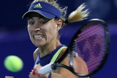 epa06546997 Angelique Kerber of Germany in action against Barbora Strycova of Czech Republic during their first round match of the WTA Dubai Duty Free Tennis Championships at the Dubai Tennis Stadium, United Arab Emirates, 20 February 2018.  EPA/MAHMOUD KHALED