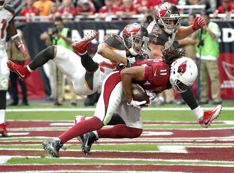 Arizona Cardinals 40 Tampa Bay Buccaneers 7: Cardinals wide receiver Larry Fitzgerald pulls in a touchdown pass. Ross D Franklin / AP Photo