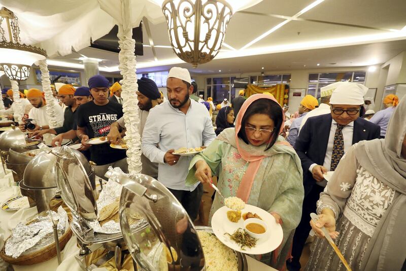 Dubai, United Arab Emirates - May 15, 2019: People take part in a multi faith Iftar at Gurunanak Darbar Sikh Gurudwara. Wednesday the 15th of May 2019. Jebel Ali, Dubai. Chris Whiteoak / The National