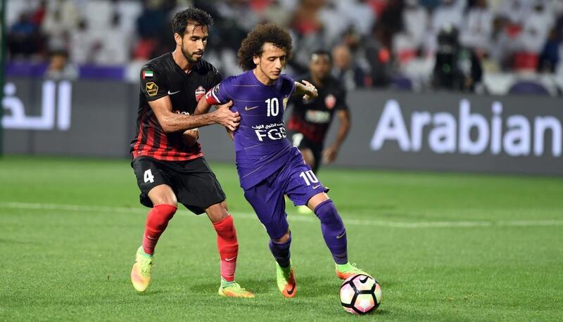 Al Ain's Omar Abdulrahman dribbles past Al Ahli's Habib Al Fardan during their Arabian Gulf League match on Saturday, January 28, 2017.