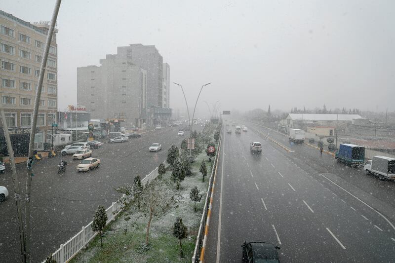 Snow fills the air in Erbil. AP Photo