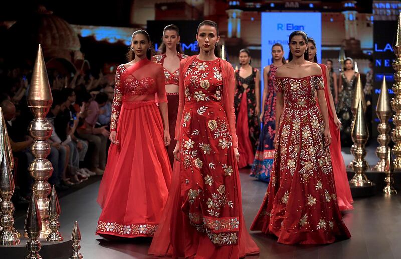 Designer Nachiket Barve works with bridal shades of red for his collection. AFP
