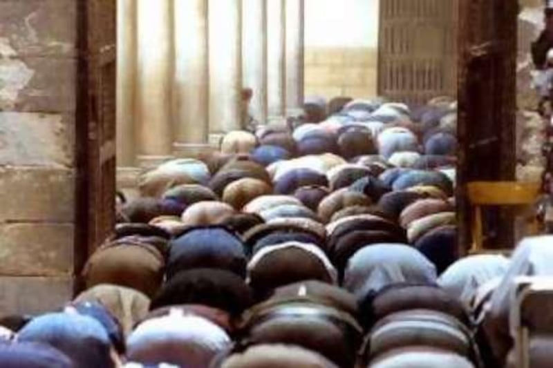 Egyptain Muslim worshipers praying at al-Azher mosque during Friday prayers, March 21, 1997. Hundreds of Muslim worshipers joined political leaders and activists in a protest Friday demanding Jihad, or holy war against Israel and to protest the construction of a Jewish nighborhood in Arab east Jerusalem. (AP Photo/ Mohamed El-Dakhakhny)