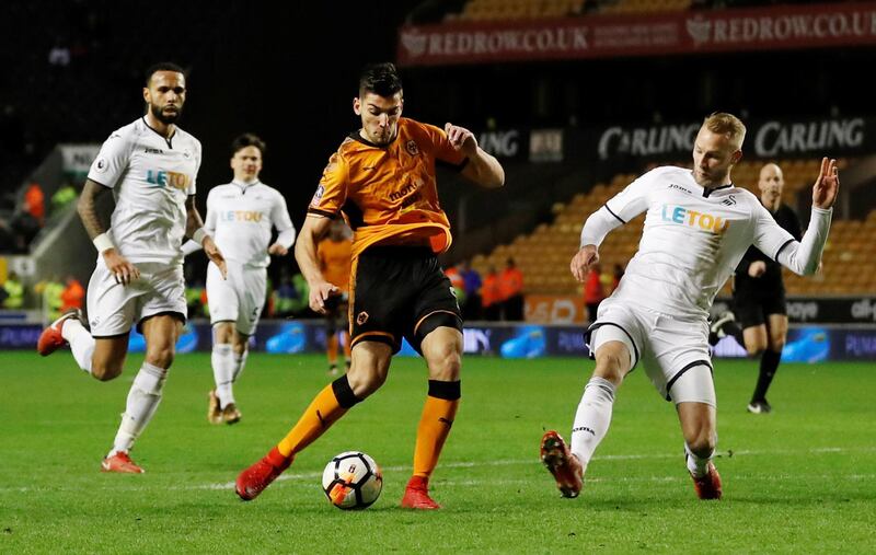 Soccer Football - FA Cup Third Round - Wolverhampton Wanderers vs Swansea City - Molineux Stadium, Wolverhampton, Britain - January 6, 2018   Wolverhampton Wanderers' Rafael Mir Vicente has a shot at goal as Swansea City's Mike van der Hoorn attempts to block   Action Images via Reuters/Andrew Boyers