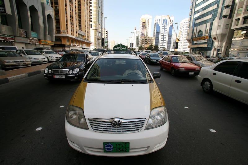 Abu Dhabi - April 1st 2008 -  A Taxi sits in traffic on in central Abu Dhabi (Andrew Parsons / The National) *** Local Caption *** AP007-0104-AD24.jpg