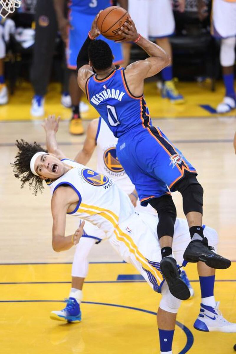 Russell Westbrook #0 of the Oklahoma City Thunder goes up for a shot against Anderson Varejao #18 of the Golden State Warriors in Game Seven of the Western Conference Finals during the 2016 NBA Playoffs at ORACLE Arena on May 30, 2016 in Oakland, California. Thearon W. Henderson/Getty Images/AFP