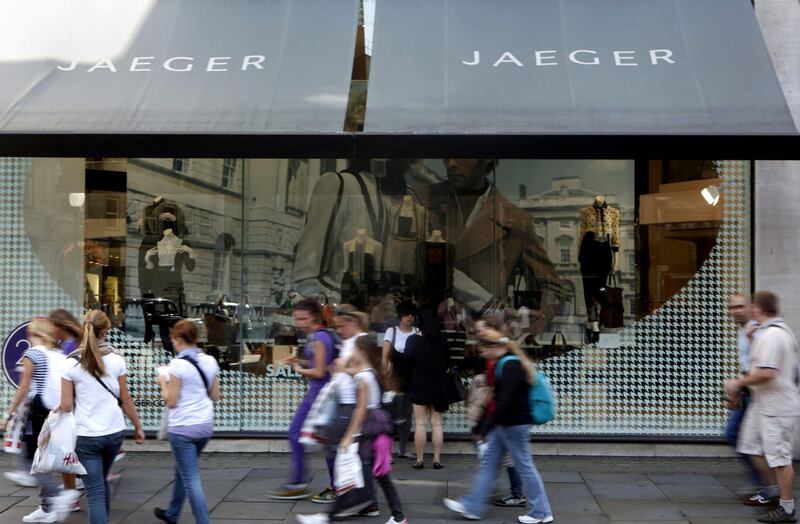 Pedestrians walk past a Jaeger store on Regent Street in London, U.K., on Tuesday, Sept. 8, 2009. Aquascutum Group Plc, the 158-year-old clothing label endorsed by British royalty and actor Pierce Brosnan, will be bought by Harold Tillman's Broadwick Group Ltd. Photographer: Jason Alden/Bloomberg