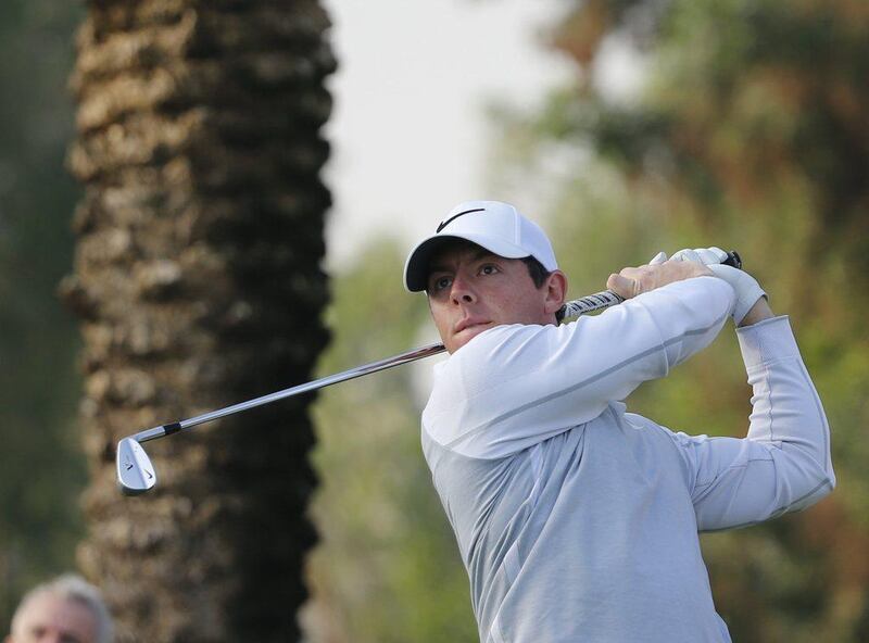 Rory McIlroy of Northern Ireland plays his third shot during the first round of the 2016 Dubai Desert Classic at the Emirates Golf Club on February 4, 2016 in Dubai. / AFP / KARIM SAHIB