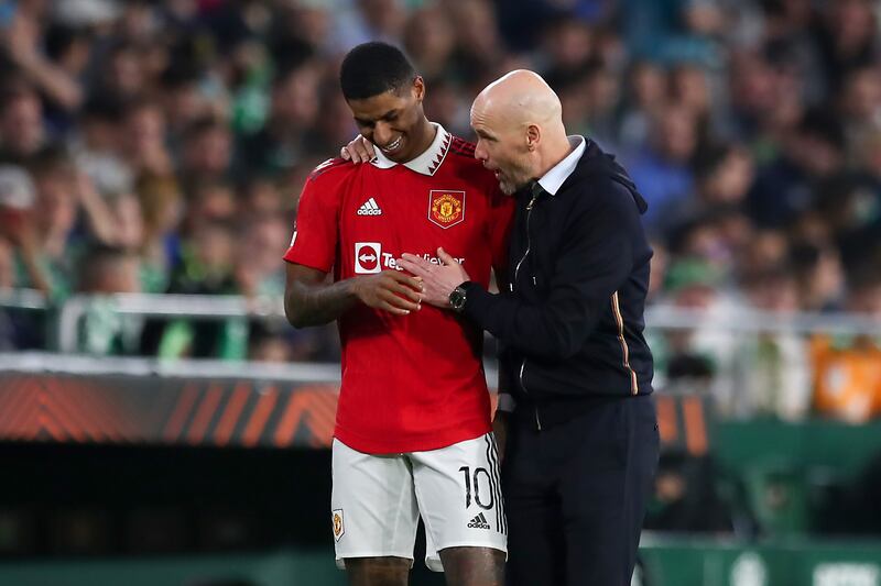 Manchester United manager Erik ten Hag, right, speaks to goalscorer Marcus Rashford after the game against Real Betis. Getty