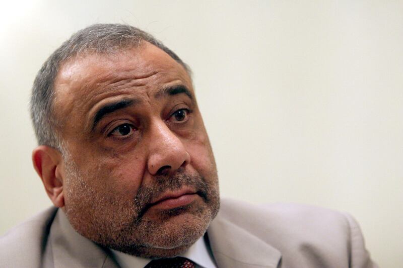 FILE - In this Jan. 3, 2006 file photo, Iraq's vice president Adel Abdul-Mahdi is seen during an interview with The Associated Press in Baghdad, Iraq. Iraq's new president Barham Salih, on Tuesday, Oct.2, 2018 has tasked veteran Shiite politician Adel Abdul-Mahdi with forming a new government nearly five months after national elections were held.  (AP Photo/Khalid Mohammed, File)