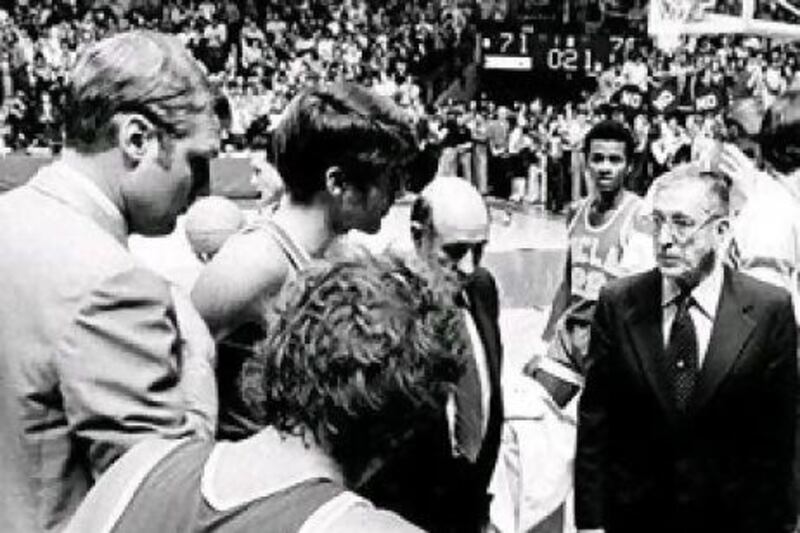 W With the game on the line UCLA basketball players huddle around their coach, the legendary leader John Wooden. This game at Notre Dame, a 71-70 loss on January 19, 1974, ended the Bruins' 88-game winning streak, but the team would go on to win a 10th national championship one year later. AP Photo