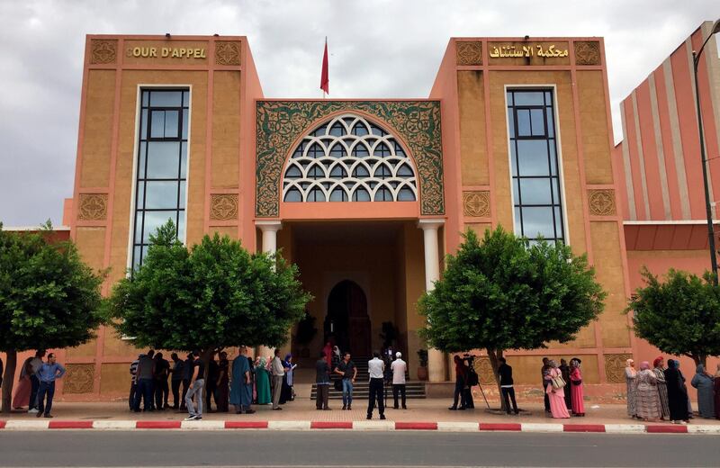 The courthouse of Beni Mellal, Morocco is pictured, Thursday, Sept. 6, 2018. Family members of a dozen young men suspected in the gang-rape, forcible tattooing and torture of a 17-year-old Moroccan girl, Khadija, allegedly held captive for two months made a ruckus outside the courtroom where an investigative judge held his first hearing in the case. (AP Photo/Nadine Achoui-Lesage)