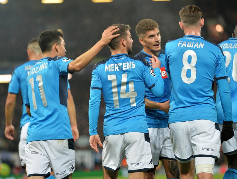 Dries Mertens (no.14) of Napoli celebrates with teammates after scoring the opening goal against Liverpool. EPA