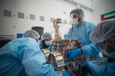 Emirati engineers carry the Rashid rover inside a clean room in the Mohammed bin Rashid Space Centre on June 15. Photo: MBRSC