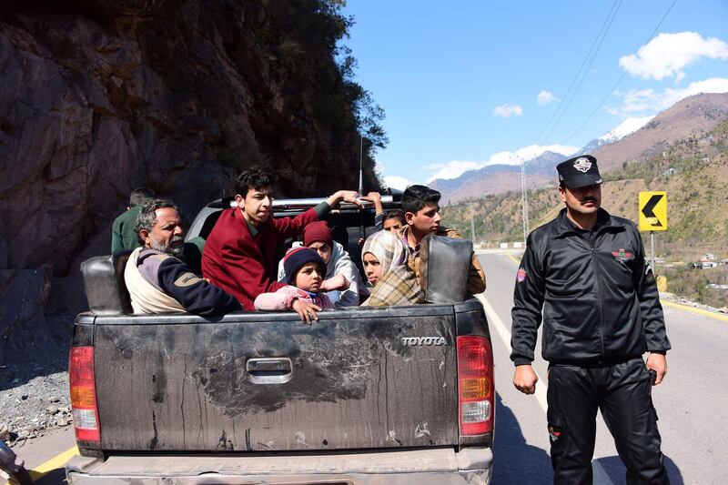 Pakistani Kashmiri residents evacuate from the border town of Chakothi in Pakistan administered Kashmir. AFP