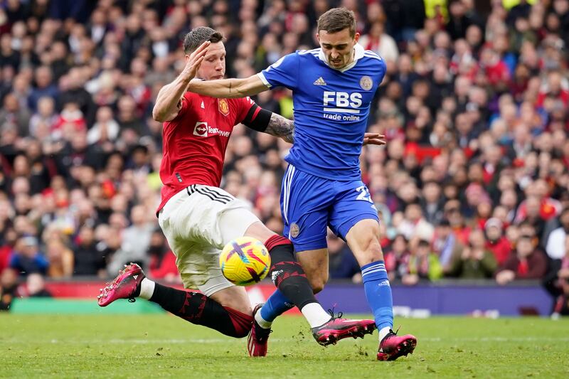 Leicester's Dennis Praet is challenged by Manchester United's Wout Weghorst. AP 