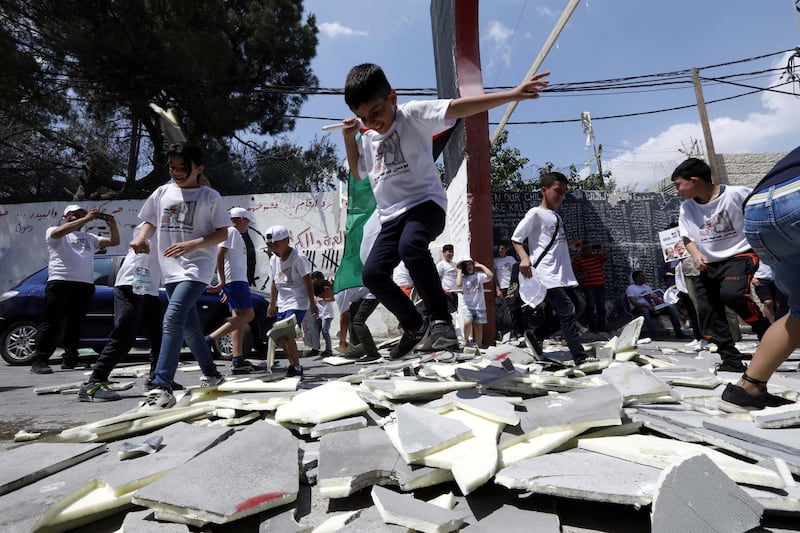 Palestinians break a mock of the Israeli separation wall during a marathon  against the so-called 'Deal of the Century', planned by Donald Trump to solve the conflict between Palestine and Israel. EPA