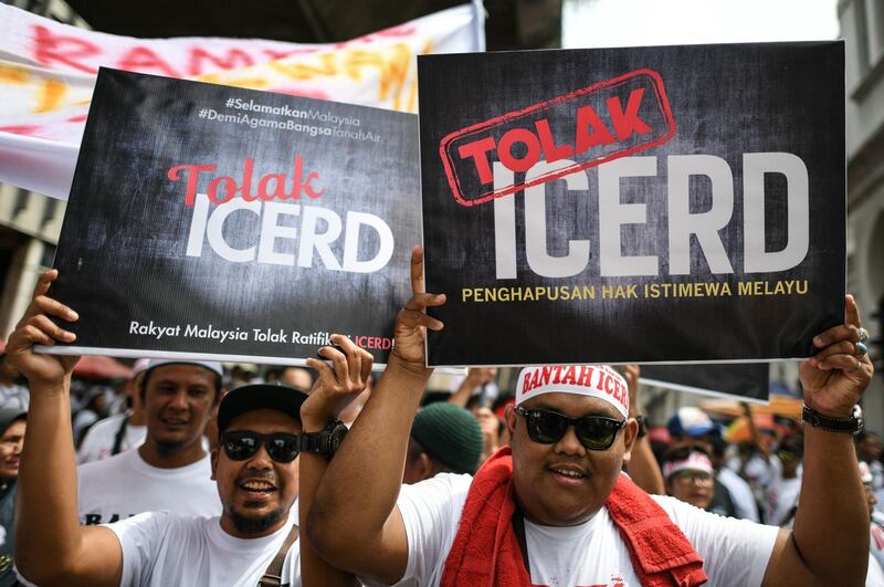Protesters display placards reading "No To Icerd" during a rally organised by Muslim politicians against the signing of the UN anti-discrimination convention (ICERD) at Merdeka Square in Kuala Lumpur.  AFP