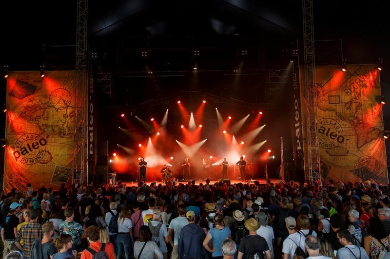 Canzoniere Grecanico Salentino, a traditional music ensemble dedicated to pizzica, the tarantella salentin, performs on the Le Dome stage, during the 43th edition of the Paleo Festival, in Nyon, Switzerland.  EPA / SALVATORE DI NOLFI