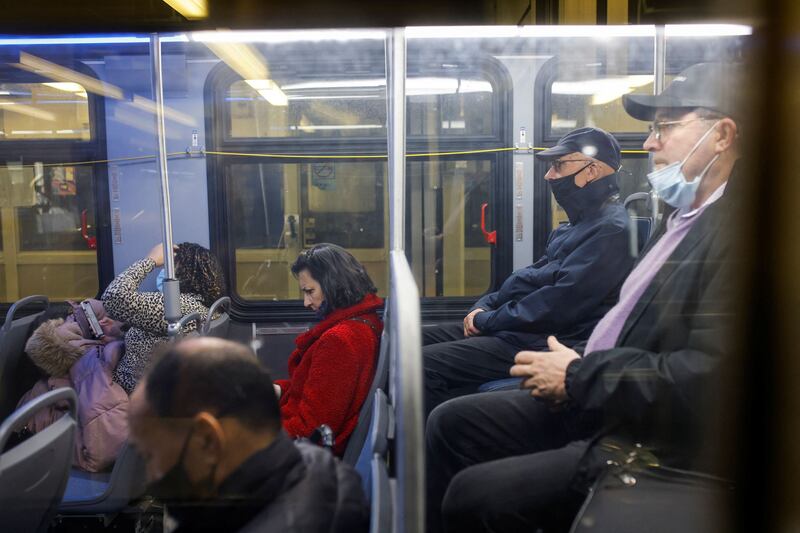 People ride a New Jersey bus after the US government announced it would no longer enforce a mask mandate on public transport. Reuters