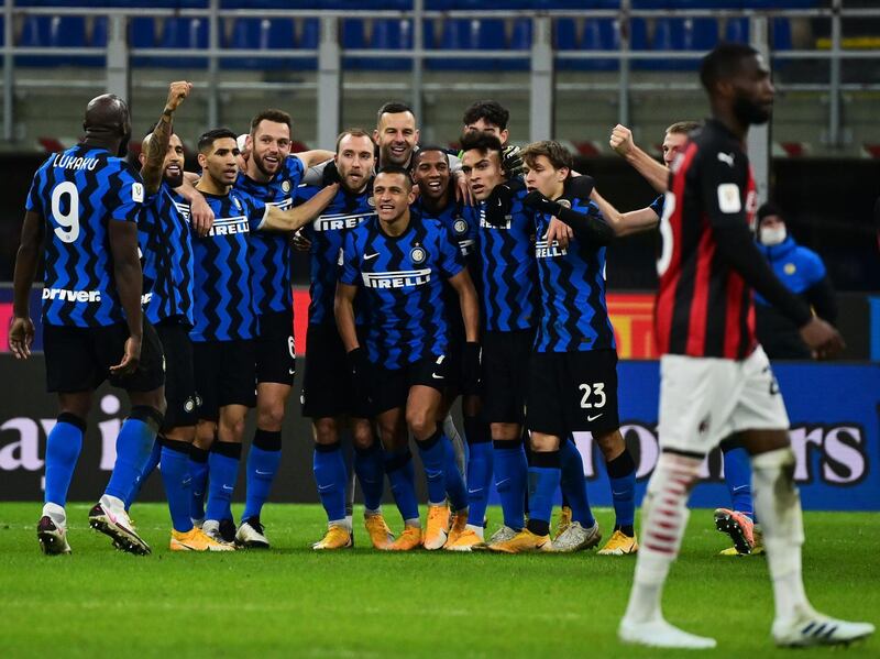 Inter Milan's players celebrate Christian Eriksen's late winner. AFP