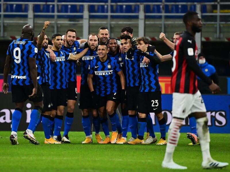 Inter Milan players celebrate after Danish midfielder Christian Eriksen scored the winning goal from an injury-time free-kick as they beat city rivals Inter in the Coppa Italia quarter-final tie on Tuesday, January 26. AFP