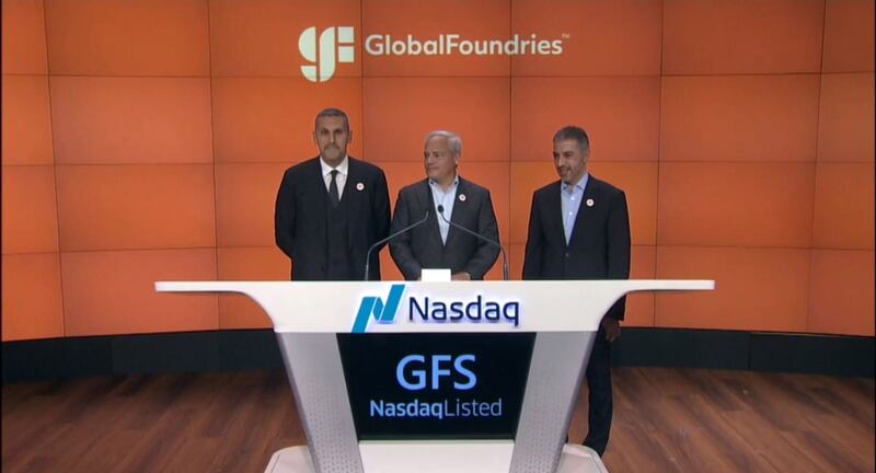 Mubadala Investment Company chief executive Khaldoon Al Mubarak, left, with Mr Caulfield, and right, Ahmed Al Idrissi, chief executive of direct investments at Mubadala and chairman of GlobalFoundries, on Thursday. Photo: Screengrab