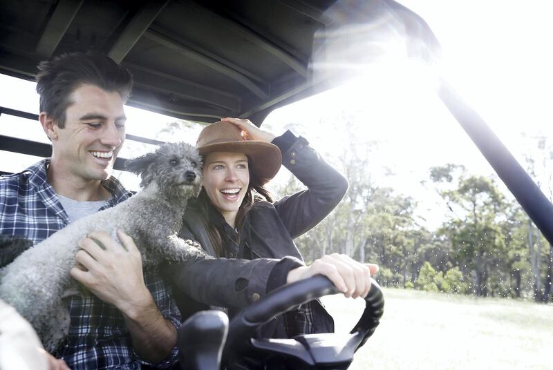 SOUTHERN HIGHLANDS, AUSTRALIA - APRIL 13: Australian Cricketer Pat Cummins, his fiancÃ© Becky Boston and their dog Norman ride on their farm buggy while in isolation at their property south of Sydney on April 13, 2020 in Southern Highlands, Australia. Cummins, who is due to commence his record-breaking Indian Premier League deal worth 155 million Indian rupees ($A3.2m), has been home isolating at his property south of Sydney due to the ongoing COVID-19 epidemic. (Photo by Ryan Pierse/Getty Images)