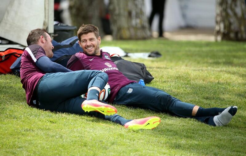Wayne Rooney and Steven Gerrard relax during England's World Cup 2014 training session on Wednesday. Richard Heathcote / Getty Images / May 21, 2014
