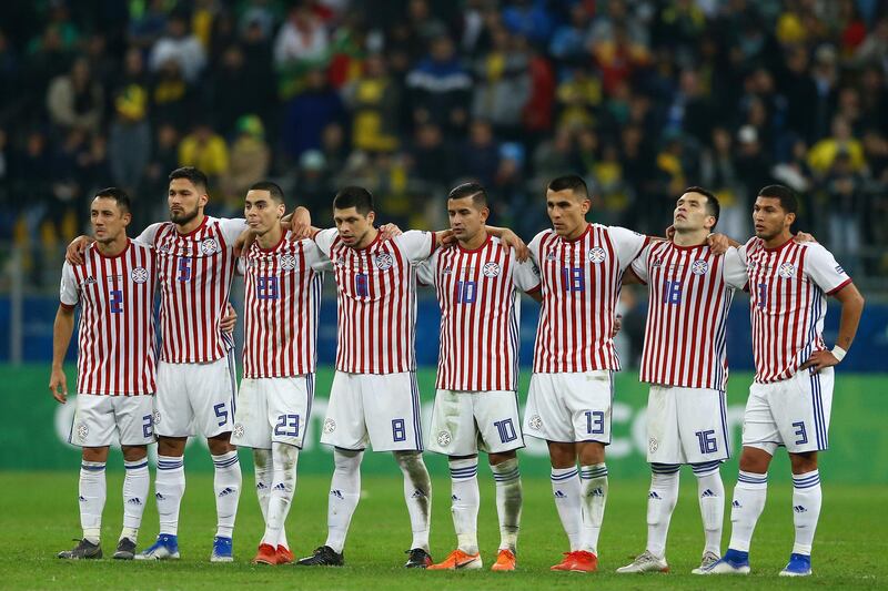 Players of Paraguay line up during the penalty shootout. Getty Images