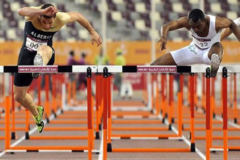 Algeria’s Othman Hadj Lazib, left, and Saudi Arabia’s Ahmed Khader Al Muallad competed in the men’s 110-metres final.