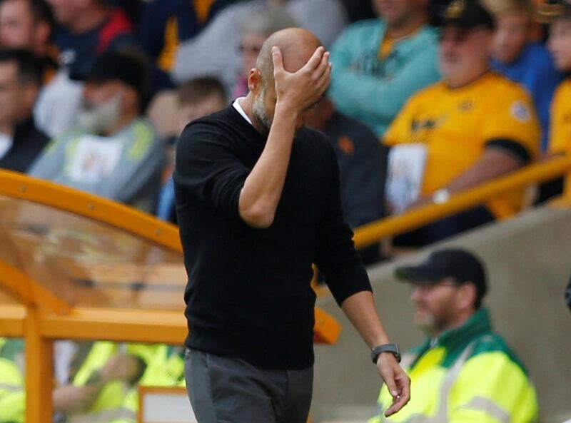 Manchester City manager Pep Guardiola looks dejected during the match. Reuters