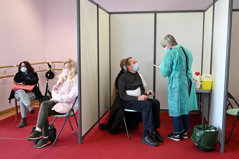 People wait to receive a dose of a vaccine in Nogent-sur-Marne, near Paris, France. EPA