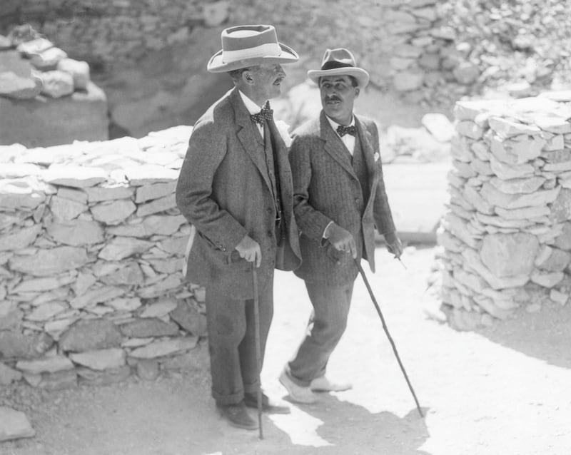 English Egyptologist Howard Carter (1874 - 1939, right) walks with the patron of his research, archaeologist and 5th Earl, Lord Carnarvon George Herbert (1866 - 1923), at the Valley of the Kings excavation site, Egypt. That year the pair discovered the tomb of King Tutankhamen.  (Photo by Hulton Archive/Getty Images)