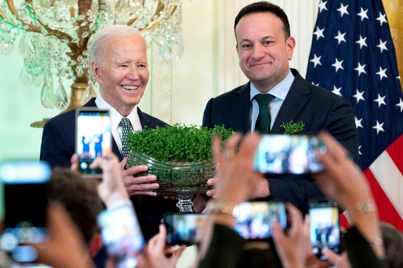 Mr Varadkar presents US President Joe Biden with a bowl of shamrocks at the White House in Washington in March 2024. Bloomberg