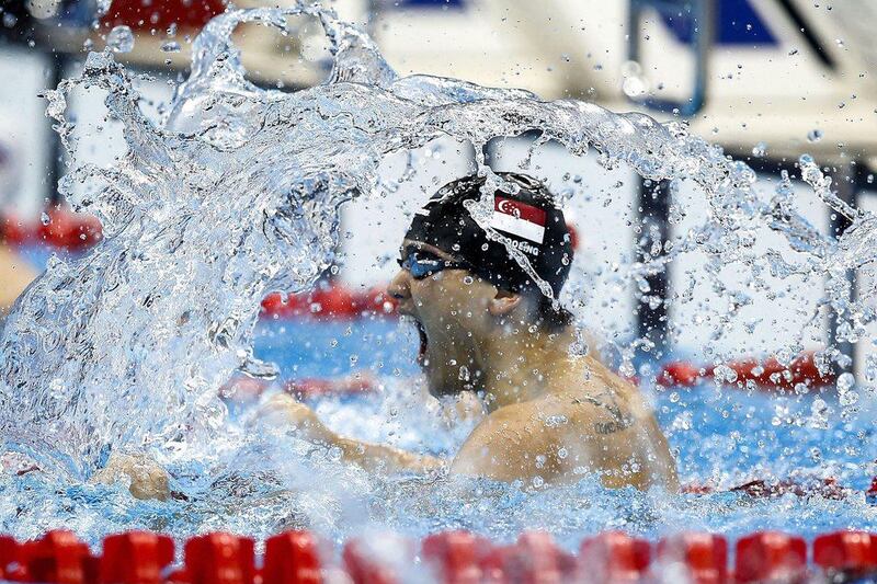 Joseph Schooling of Singapore celebrates after winning in the men's 100m butterfly at the Rio 2016 Olympics on Friday. Patrick B Kramer / EPA / August 12, 2016