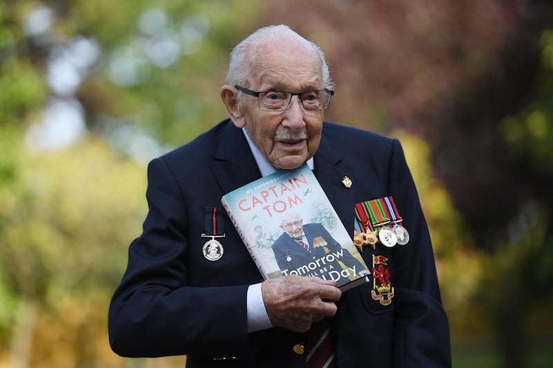 Captain Sir Tom Moore poses for photographers to promote the launch of his book 'Tomorrow is a Good Day' at his home in Bedfordshire, Britain. EPA