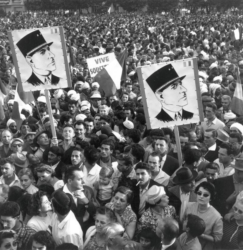 A crowd of Algerian demonstrators outside Government House, carrying Charles de Gaulle posters during the Algerian war of independence.   (Photo by Meagher/Getty Images)