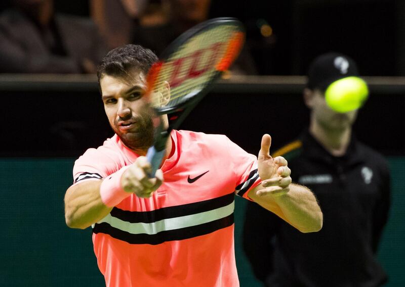 Grigor Dimitrov of Bulgaria plays a forehand return to Roger Federer of Switzerland during their men's singles final for the ABN AMRO World Tennis Tournament in Rotterdam on February 18, 2018.  / AFP PHOTO / ANP / Koen Suyk / Netherlands OUT