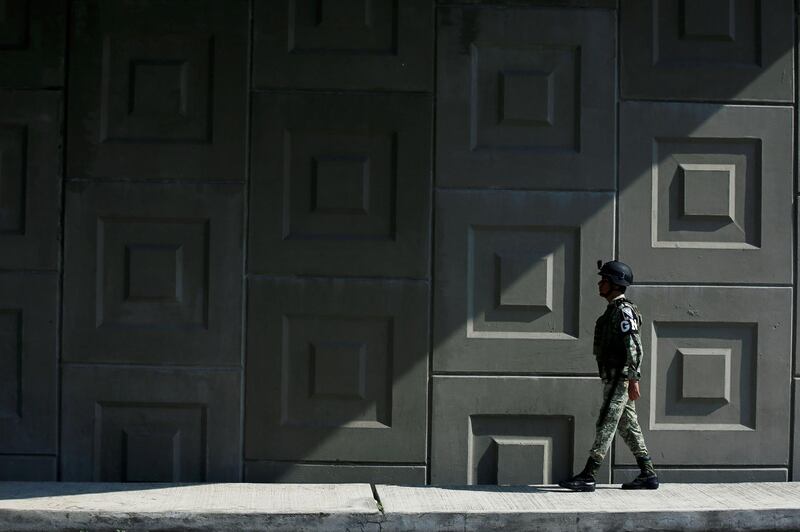A National Guard walks at a checkpoint on the motorway in Tapachula, Chiapas, Mexico.  Reuters