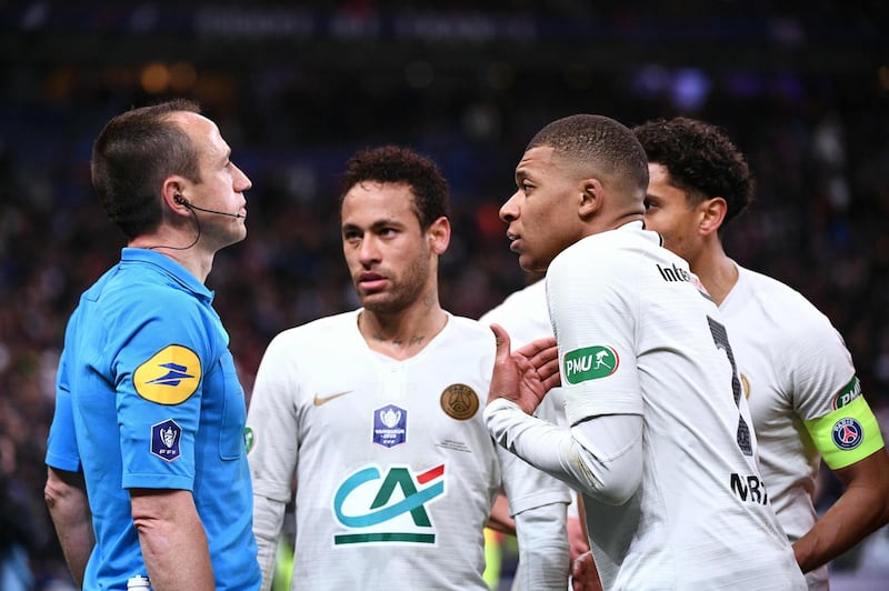 PSG forward Kylian Mbappe reacts as he receives a red card from referee Rudy Buquet. Martin Bureau / AFP