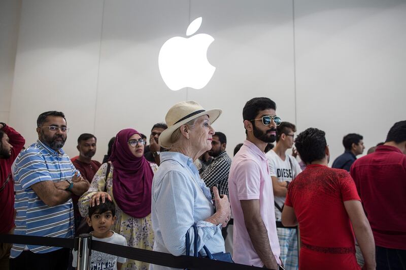 Customers queue outside an Apple store during the launch of new iPhone 11 and iPhone 11 Pro in Dubai. EPA
