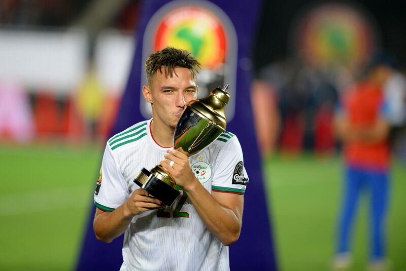 Ismail Bennacer celebrates with the trophy. AFP