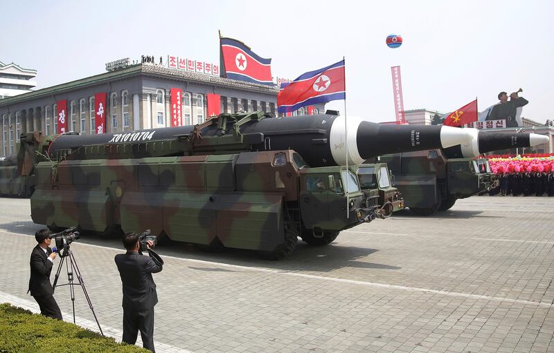 In this Saturday, April 15, 2017, file photo, what analysts believe could be the North Korean Hwasong 12 is paraded across Kim Il Sung Square during a military parade in Pyongyang, North Korea. Threatening to fire a volley of missiles toward a major U.S. military hub _ and the home to 160,000 American civilians _ may seem like a pretty bad move for a country that is seriously outgunned and has an awful lot to lose. But pushing the envelope, or just threatening to do so, is what North Korea does best. (AP Photo/Wong Maye-E, File)
